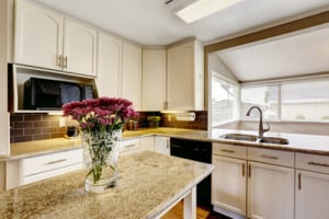 Kitchen island with granite top and flowers