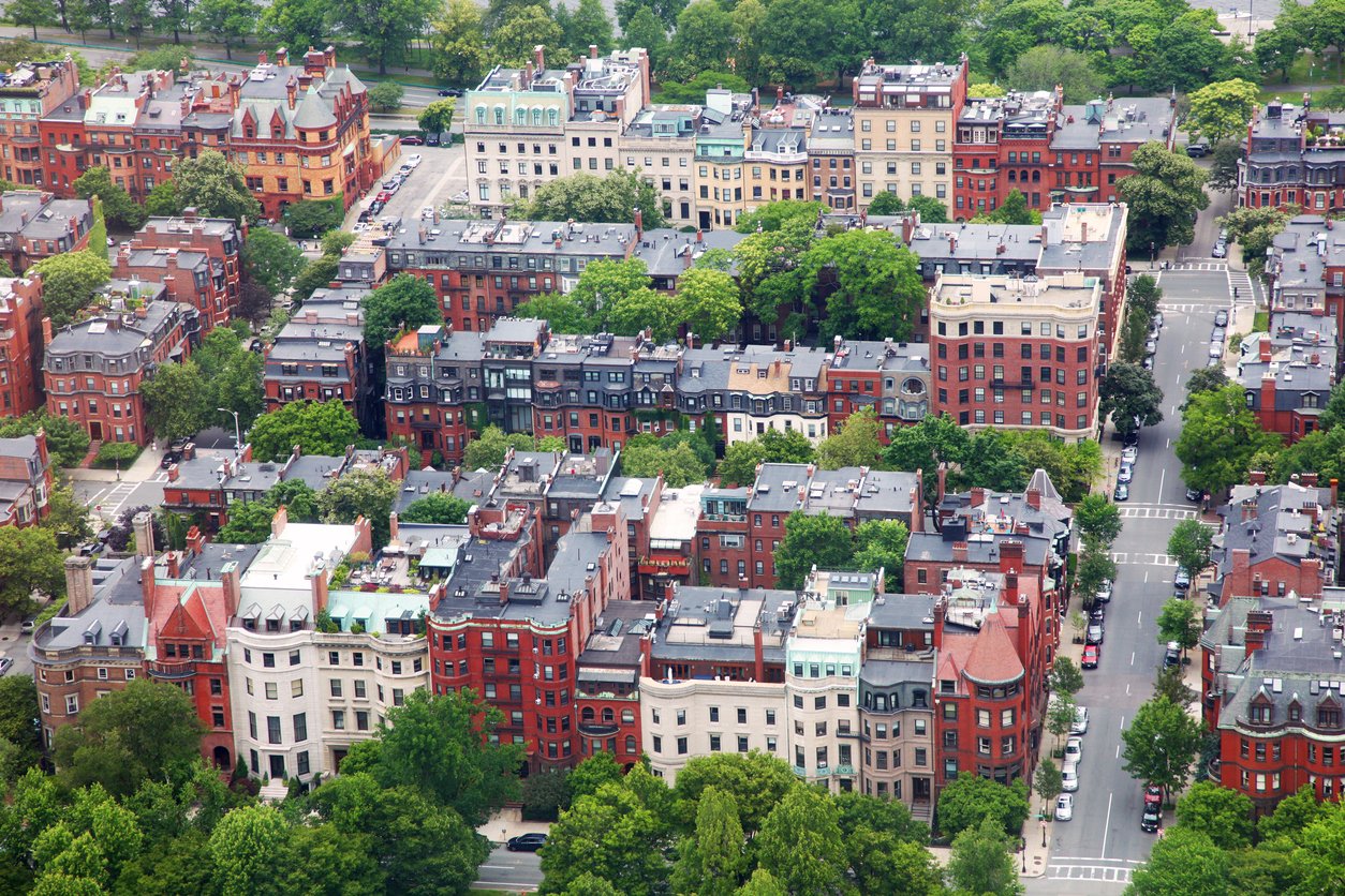 Several residential homes shown in an aerial shot of Massachusetts.