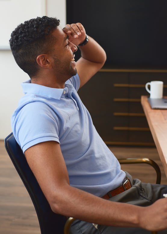 CHARLESGATE agent leaning back in chair and laughing