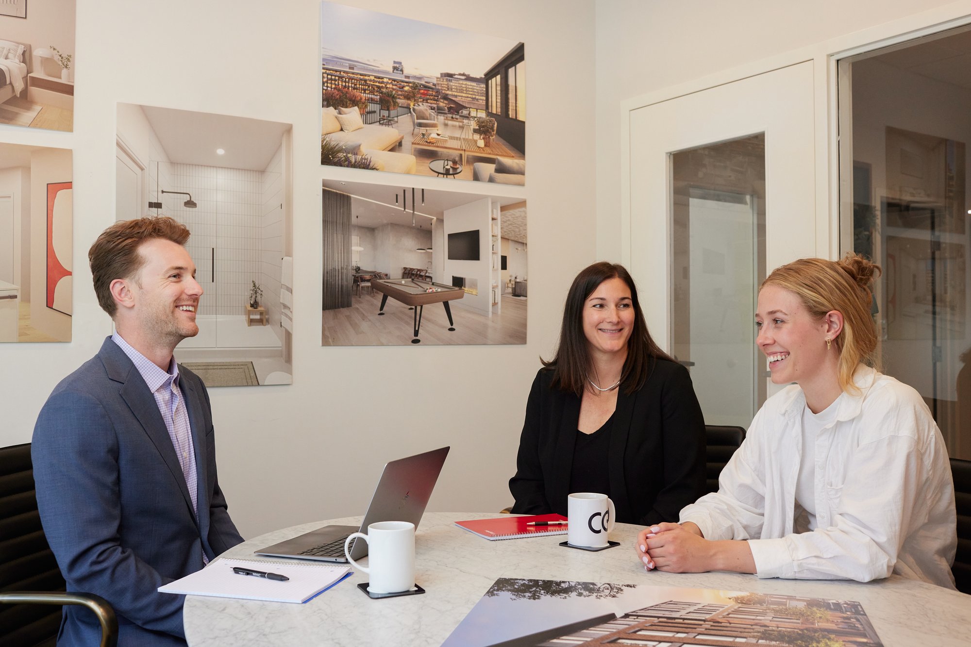 CHARLESGATE agents working together at conference table