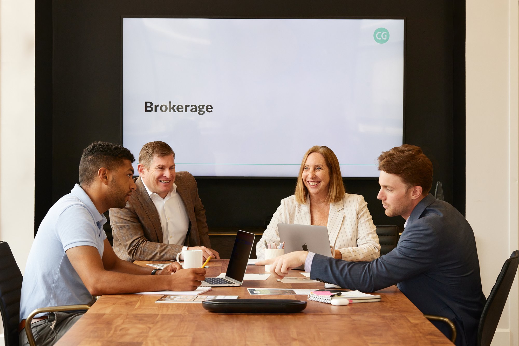 CHARLEGATE agents sitting around a table working together